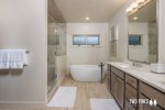 Master Bathroom En Suite with Luxurious Soaking Tub and Walk In Shower